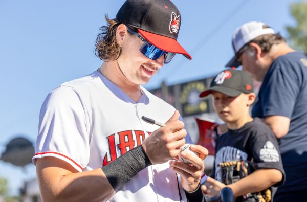 New Jersey Jackals third baseman Trevor Abrams signs autographs for fans prior to the start of the June 4th, 2022 contest against the Quebec Capitales. Photo by Phil Hoops