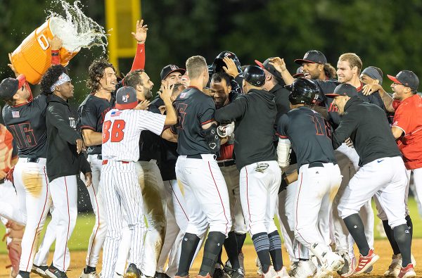 The New Jersey Jackals celebrate a walk-off victory in the bottom of the ninth inning over the Joliet Slammers on May 26th, 2022 at Yogi Berra Stadium. Photo by Phil Hoops